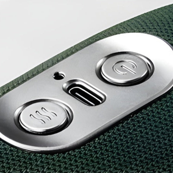 Close-up of a control panel with buttons on a green textured surface