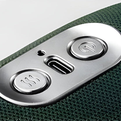 Close-up of a control panel with buttons on a green textured surface